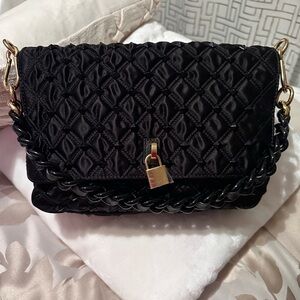 Authentic Marc Jacob’s satin bag.